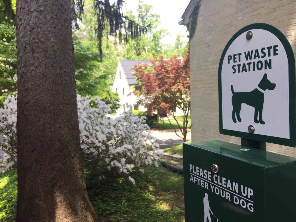 Pet Waste Station sign board on the wall